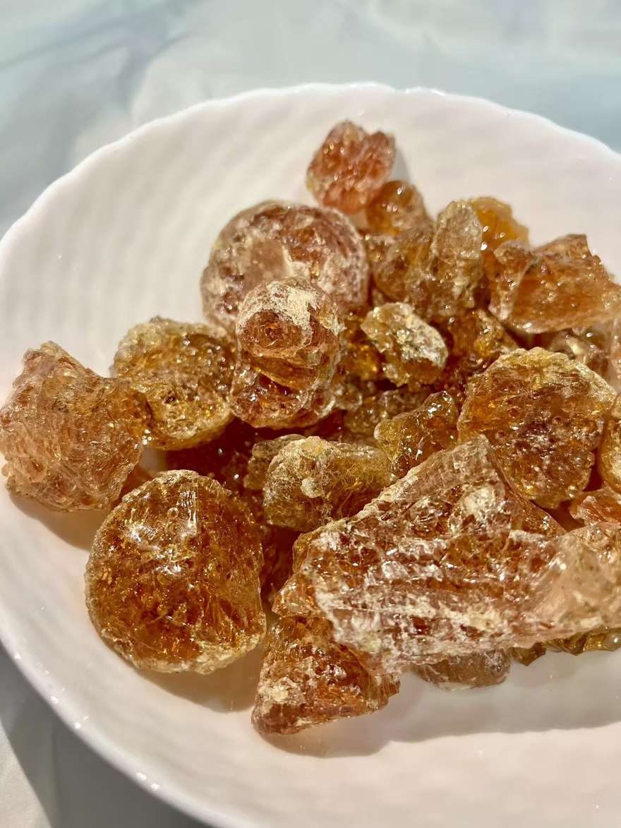 Grade 2 Acacia seyal gum arabic with a spoon